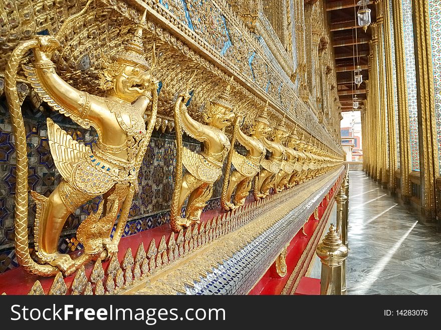 The statue garuda fairy tale animal of thai buddhist native on the temple wall at wat prokeaw temple in bangkok province, metropolis of Thailand. The statue garuda fairy tale animal of thai buddhist native on the temple wall at wat prokeaw temple in bangkok province, metropolis of Thailand