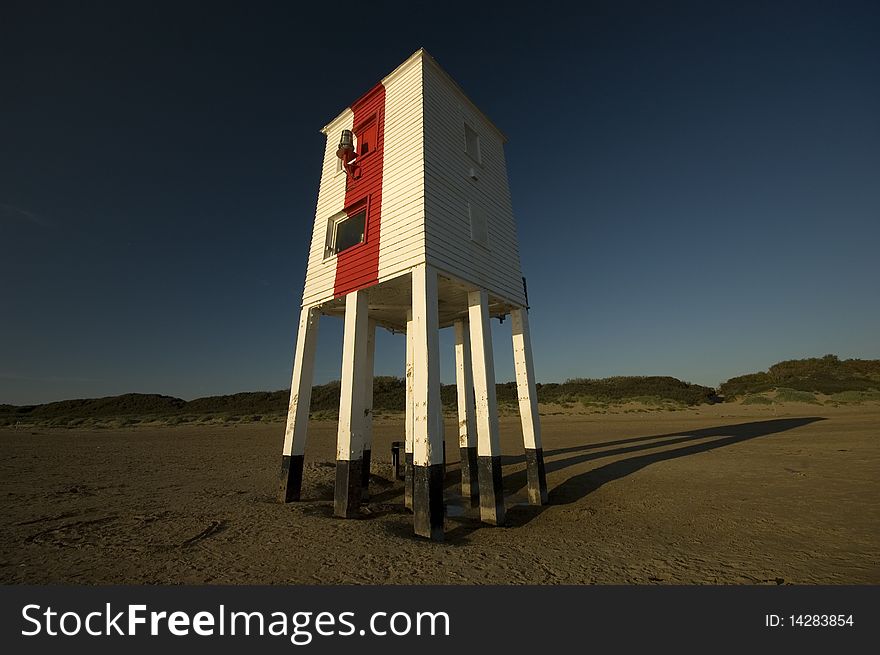 Unusual wooden lighthouse on stilts.
Taken at sunset using a polariser filter on a wide angle lens.