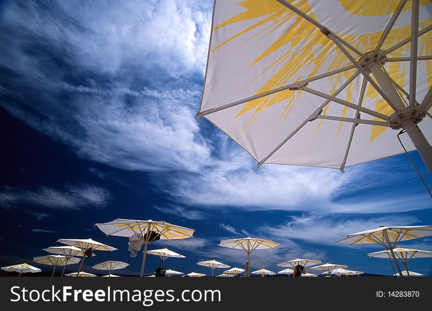 Parasols In Front Of Blue Sky