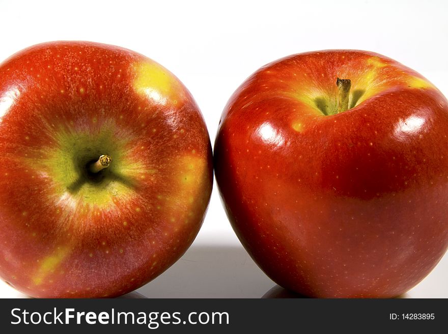 Ripe red apple on a white background