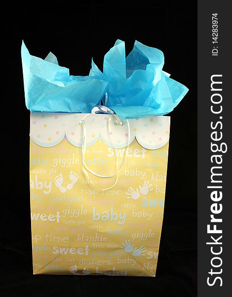 A gift box for a baby boy with black background. A gift box for a baby boy with black background