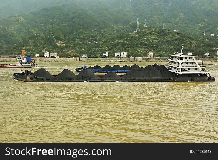Coal barges on the Yangtze river in Central China. Coal barges on the Yangtze river in Central China