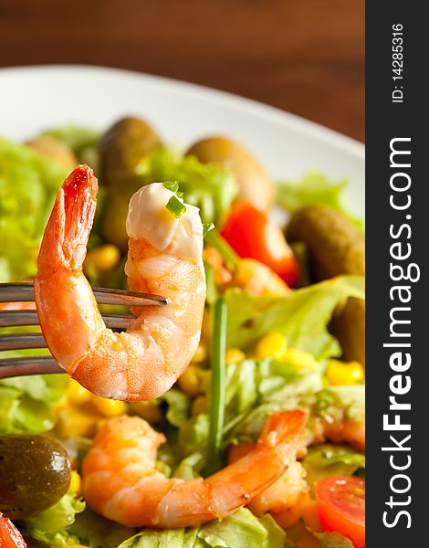 Photo of colorful salad with shrimps, mais and lettuce. Photo of colorful salad with shrimps, mais and lettuce