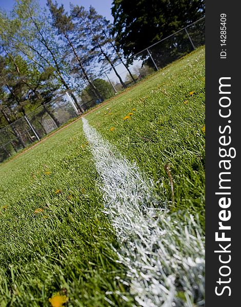 Foul line on a grass baseball field