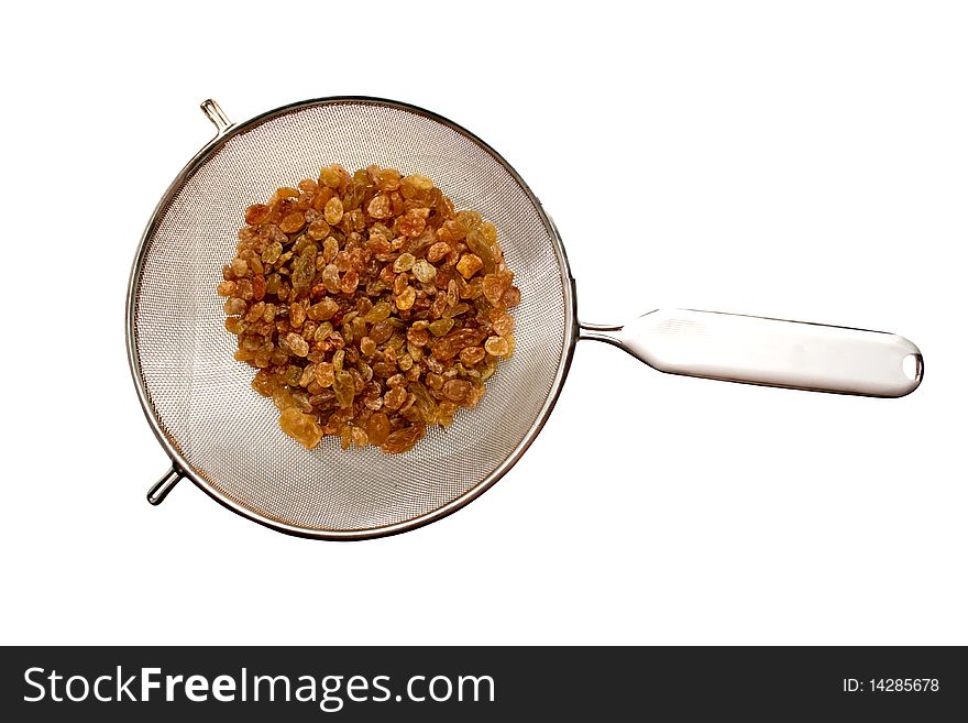 Raisin in sieve close up on white background. Raisin in sieve close up on white background