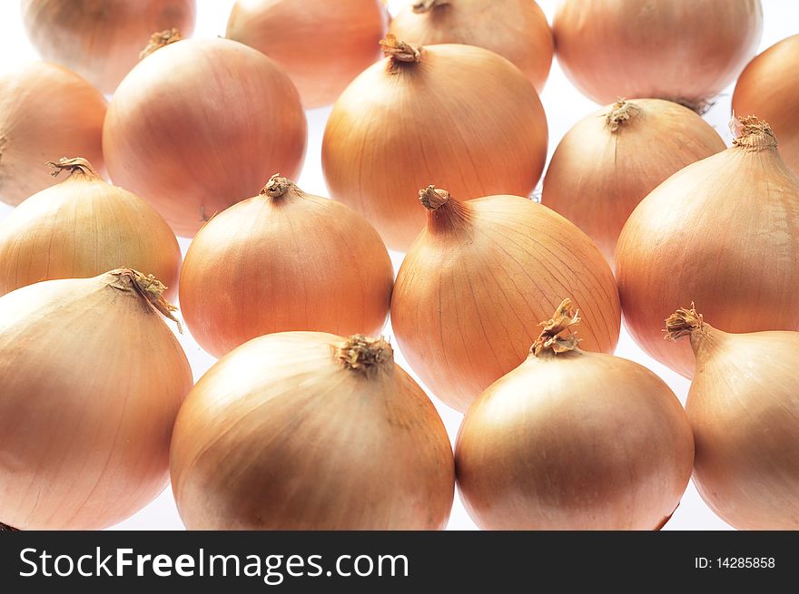 Group of onions placed together on white background