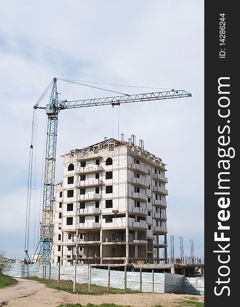 Series. crane near building on Cloudy sky background