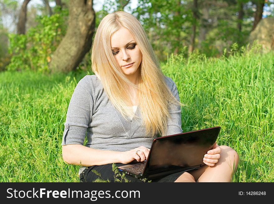 Beautiful Business Woman With The Laptop