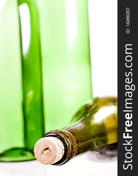 Green wine bottles on white background