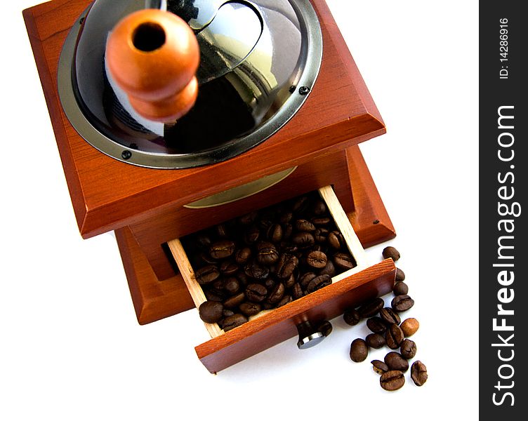 Coffee machine grinds the coffee on a white background. Coffee machine grinds the coffee on a white background