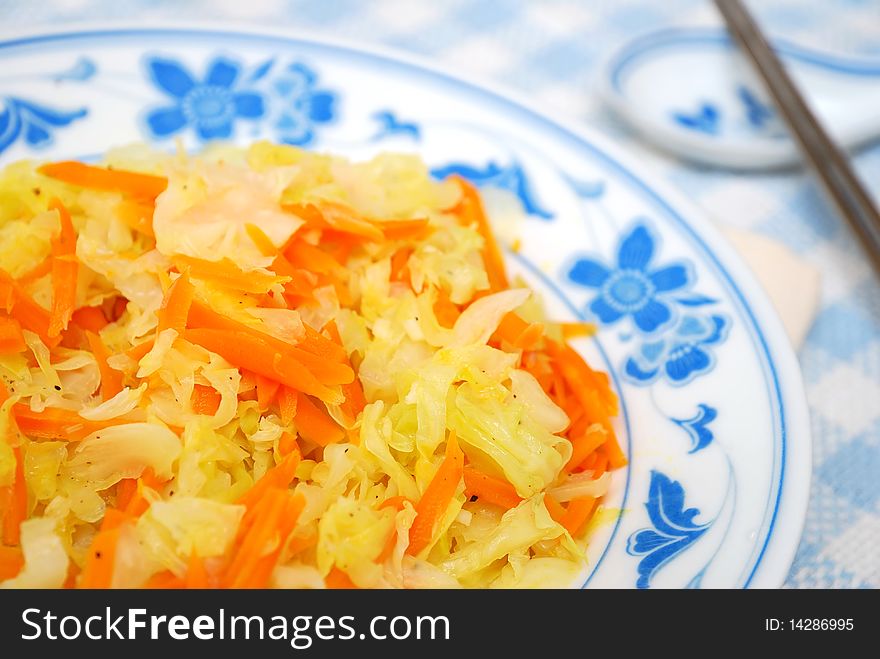 Asian healthy stir fried vegetables cooked with cabbage and carrots. For concepts such as food and beverage, diet and nutrition, and healthy eating. Asian healthy stir fried vegetables cooked with cabbage and carrots. For concepts such as food and beverage, diet and nutrition, and healthy eating.