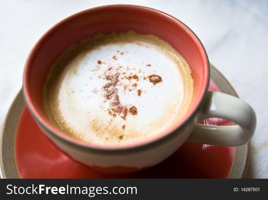 A cup of coffee on white background.