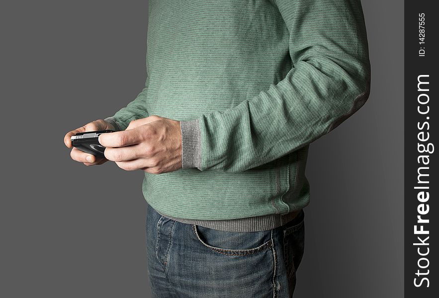 Men playing mobile videogame with grey background