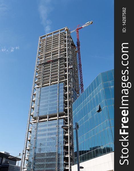Lifting crane at skyscraper construction