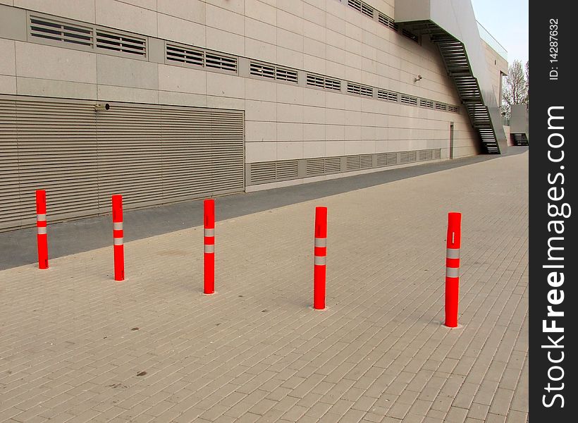 Red bollards on the street close road. Red bollards on the street close road