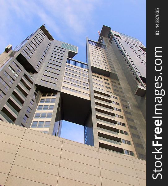 Metal and glass skyscraper with blue sky. Metal and glass skyscraper with blue sky