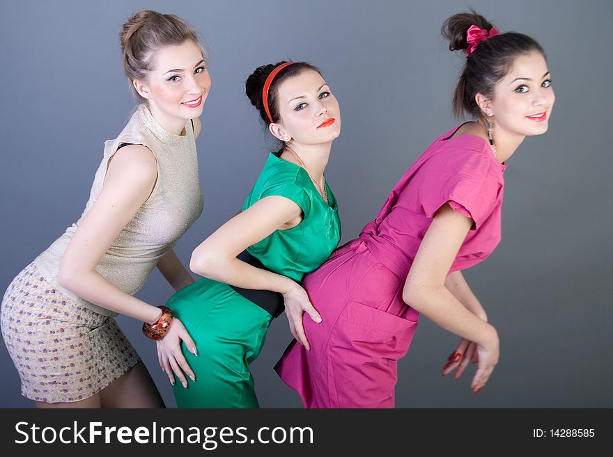 Three happy retro-styled girls studio shot