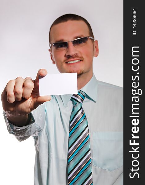 Young businessman showing business card. Young businessman showing business card