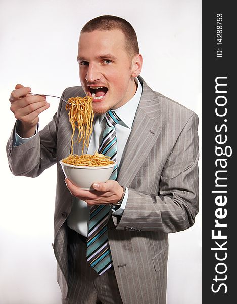 Young businessman in suit with food. Young businessman in suit with food