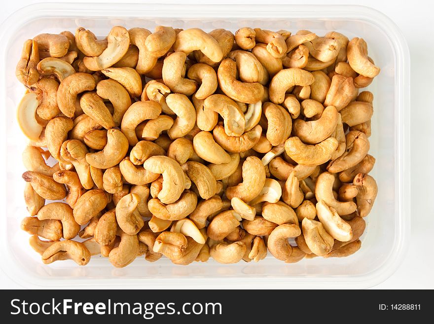 Much of nut in open box on white background