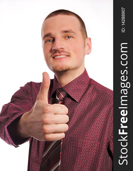 Young businessman showing thumb up. Young businessman showing thumb up