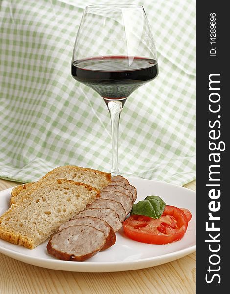 Traditional polish sausage and glass of wine