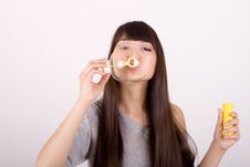 Girl Blowing Soap Bubbles Royalty Free Stock Images