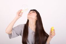 Girl Blowing Soap Bubbles Royalty Free Stock Image