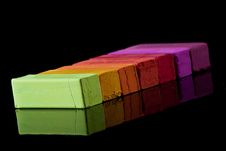 Colored Chalk On Black Reflective Background Stock Images