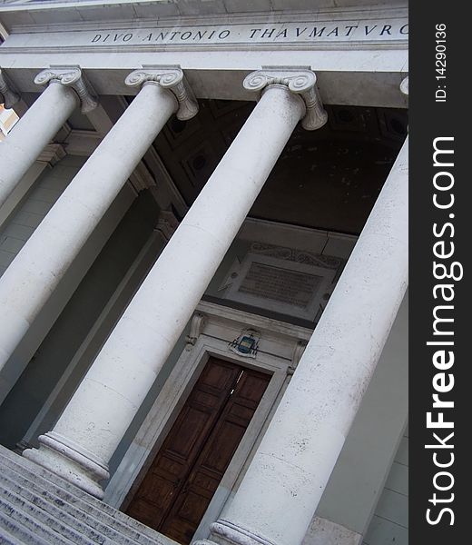 Cathedral building in Neoclassic architectural style,steps leading to the marble pillars colonnade portal and great wooden door Location: Trieste, San Antonio Taumaturgo church, Italy, Europe. Cathedral building in Neoclassic architectural style,steps leading to the marble pillars colonnade portal and great wooden door Location: Trieste, San Antonio Taumaturgo church, Italy, Europe