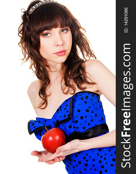 Lovely girl in a blue dress and brilliant diadem with a red apple. Lovely girl in a blue dress and brilliant diadem with a red apple