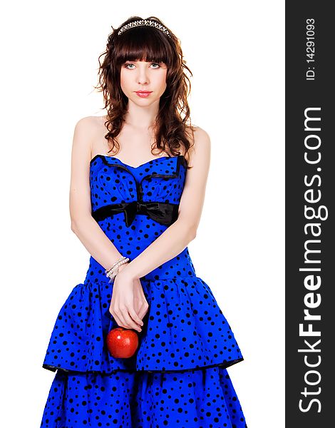 Lovely girl in a blue dress and brilliant diadem with a red apple. Lovely girl in a blue dress and brilliant diadem with a red apple