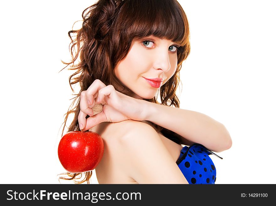Portrait of a beautiful brunette with a red apple