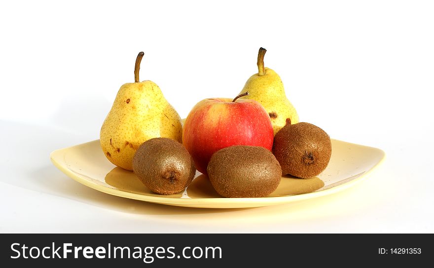 Still life with fruits on a saucer on a white background