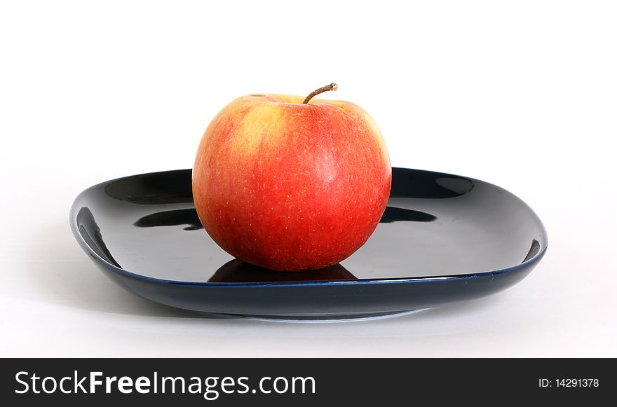 Still life with fruits on a saucer on a white background