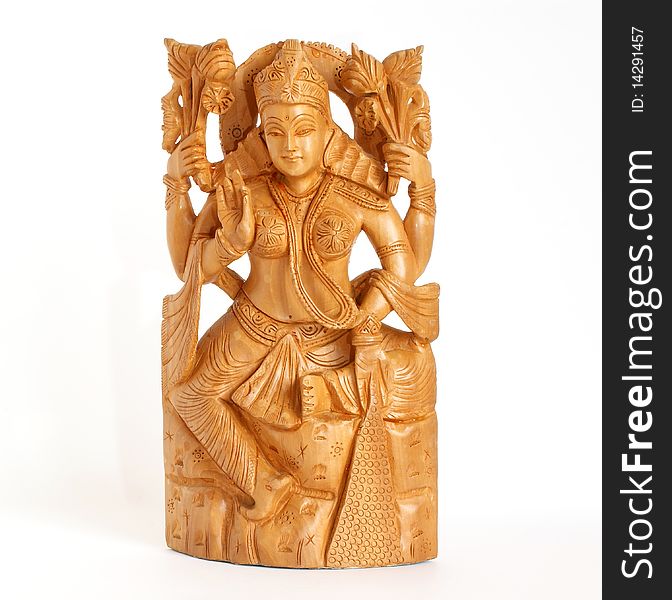 The wooden figure of God, a souvenir gift, India, in isolation