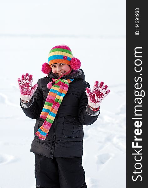 Pretty child on white snow background. Pretty child on white snow background