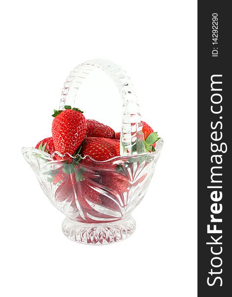 Strawberries in a glass basket isolated on white. Strawberries in a glass basket isolated on white