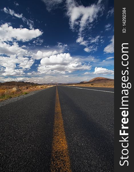 Image of a road in the karoo desert of South Africa with Clouds. Image of a road in the karoo desert of South Africa with Clouds