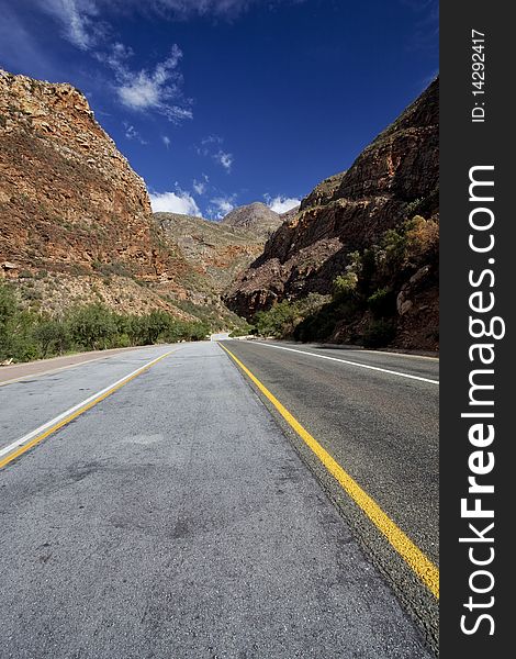 Image of a freeway between mountains in South Africa in the Western Cape. Image of a freeway between mountains in South Africa in the Western Cape.