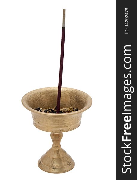 Buddhist incense in a brass bowl