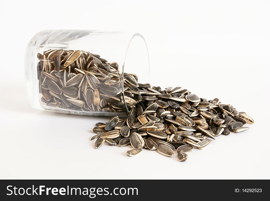 A handful of sunflower seeds, isolated on a white background