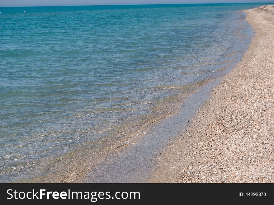 Early morning on the beach with shining clear water. Early morning on the beach with shining clear water