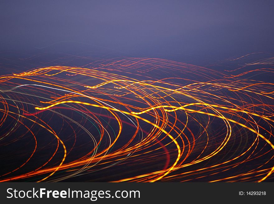 The movement of the street lights and a slow shutter speed gives the image a good point of interest. The movement of the street lights and a slow shutter speed gives the image a good point of interest.