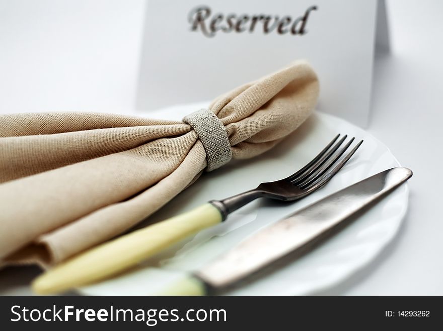An image of knife and fork on a plate. An image of knife and fork on a plate