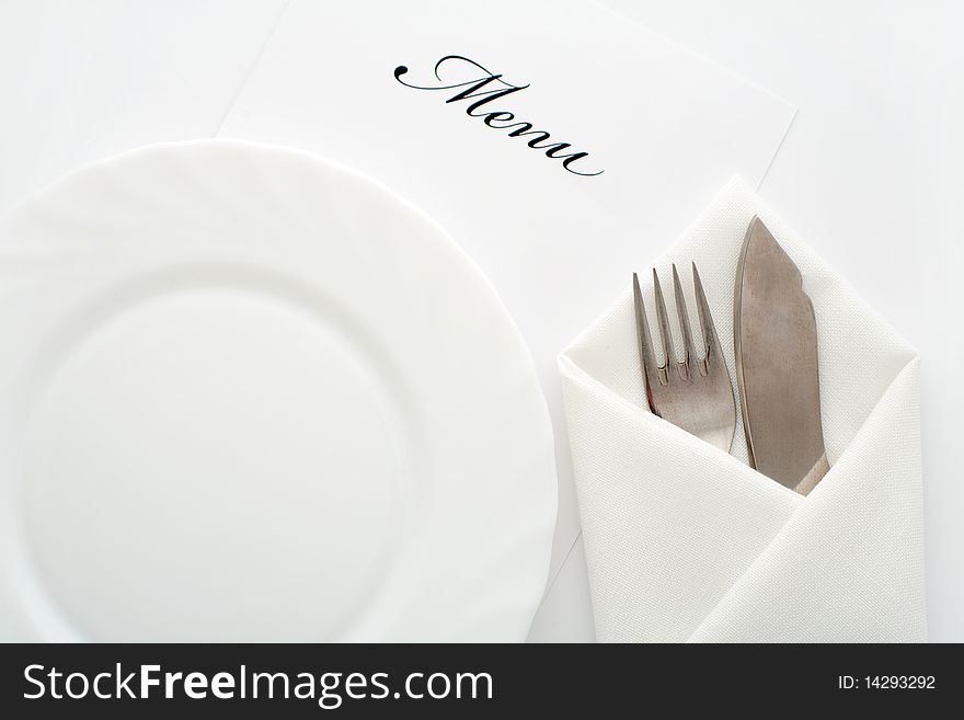 An image of a plate, knife and fork. An image of a plate, knife and fork