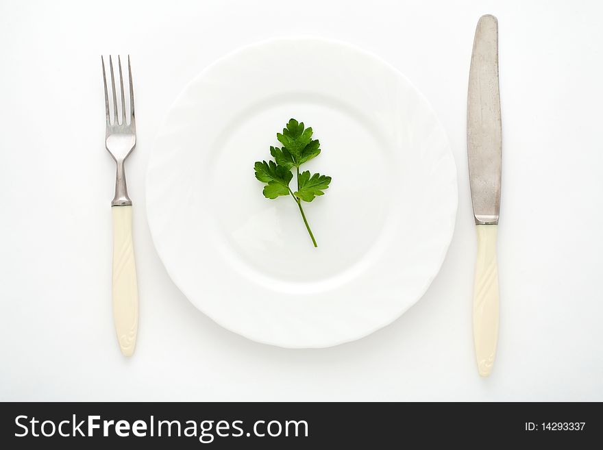 An image of fork, knife and plate