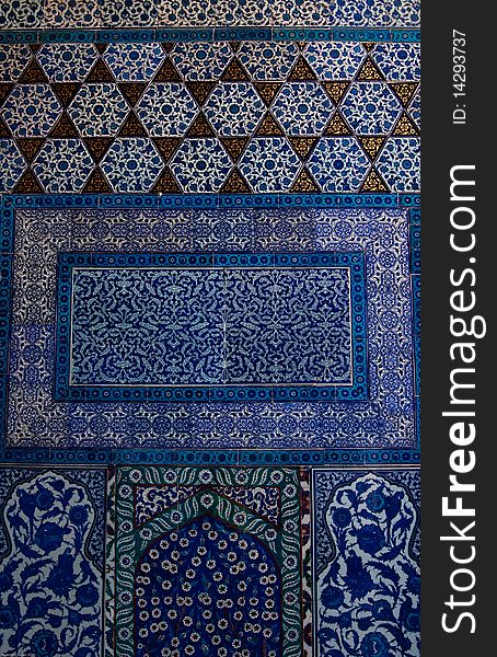 Traditional blue and white colorful tiles on a wall in the Topkapi Palace of the Sulatan, Istanbul, Turkey. Traditional blue and white colorful tiles on a wall in the Topkapi Palace of the Sulatan, Istanbul, Turkey