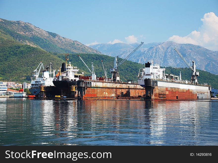 Shipyard on the coast with industrial ships