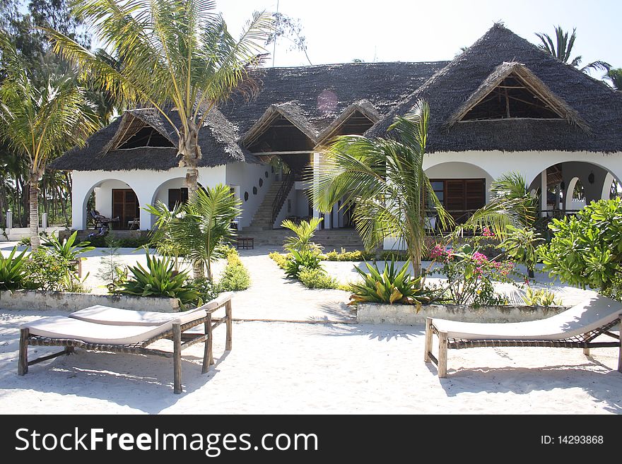 A beach resort on a palm-fringed beach in Zanzibar. A beach resort on a palm-fringed beach in Zanzibar